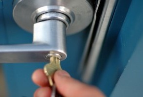 Inserting Key in Door Knob 